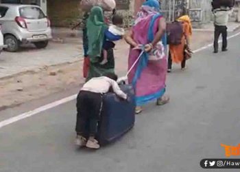 माँ की ममता : घर जाने को नहीं मिला कोई साधन, तो सुटकेस पर ही सुला कर चल दिये घर